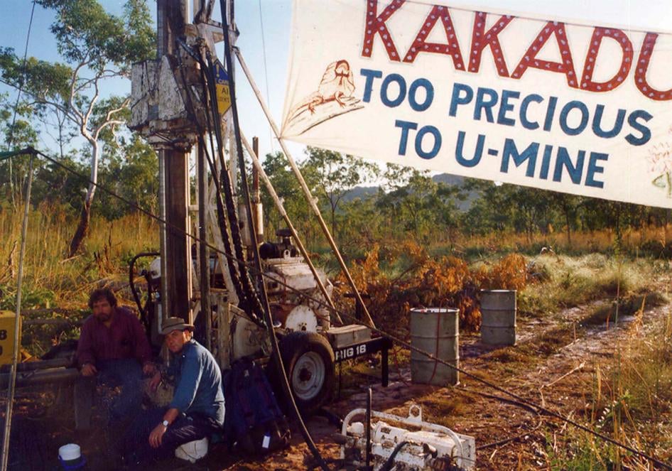 Two Jabiluka mine protesters sit chained to heavy drilling equipment installed at the proposed site of the Jabiluka Uranium mine in Jabiluka, Australia on March 24, 1998.