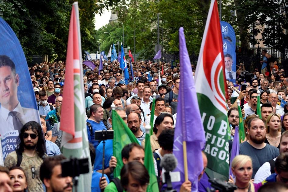 People march in Budapest, Hungary during a July 26, 2021 protest against the Hungarian government over reports that it has used Pegasus spyware.