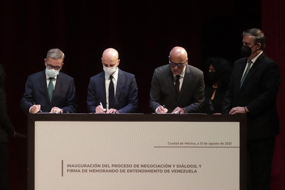 Head of the Venezuelan opposition delegation Gerardo Blyde, Kingdom of Norway representative Dag Nylander, Venezuelan National Assembly President Jorge Rodríguez, and Mexican Foreign Affairs Minister Marcelo Ebrard during the Inauguration of the Negotiation and Dialogue Process and Signature of the Memorandum of Understanding of Venezuela, at the National Museum of Anthropology on August 13, 2021, in Mexico City.