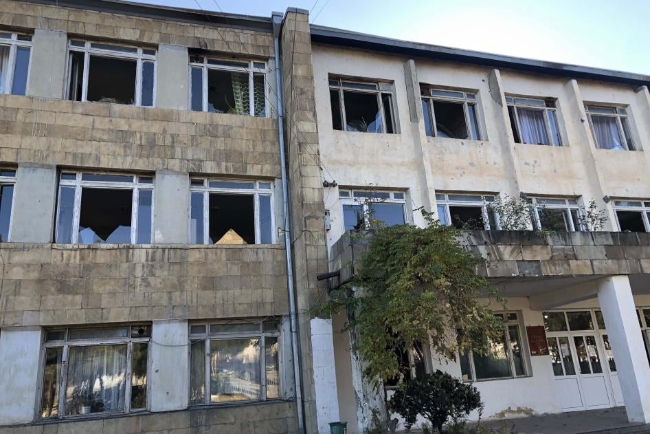 Exterior of a school building with windows blown out
