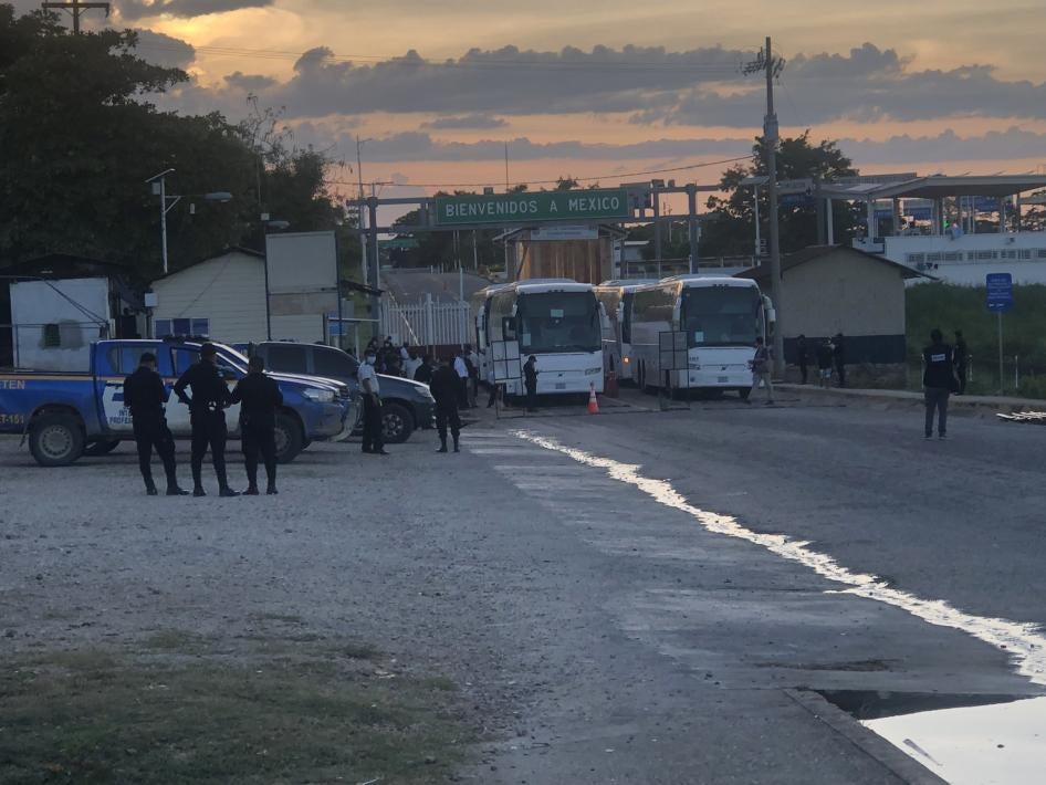 Buses sit on the Mexican side of the El Ceibo border crossing after having expelled migrants into Guatemala.