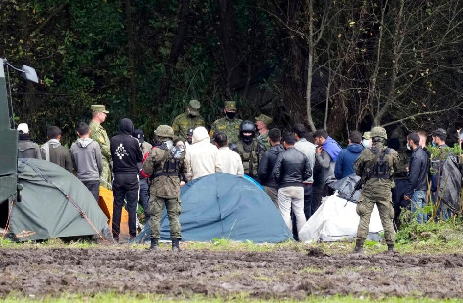 Polish security forces surround migrants at the border with Belarus in Usnarz Gorny, Poland on September 1, 2021. 