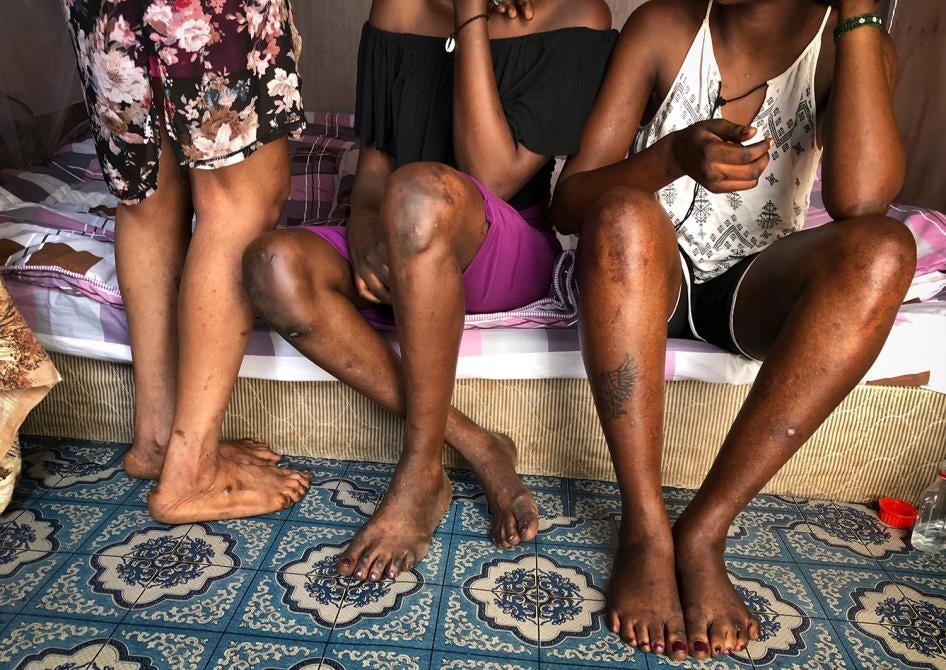 Three sex workers sit at their workplace in Juba, South Sudan on March 5, 2018.