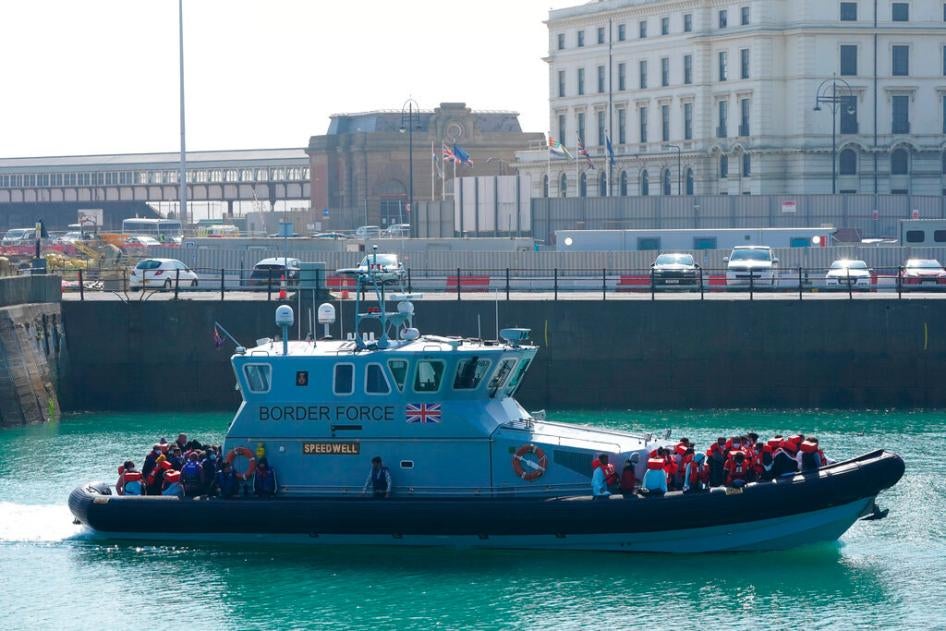 A group of people thought to be migrants are brought into Dover, Kent, by Border Force officers on September 5, 2021.