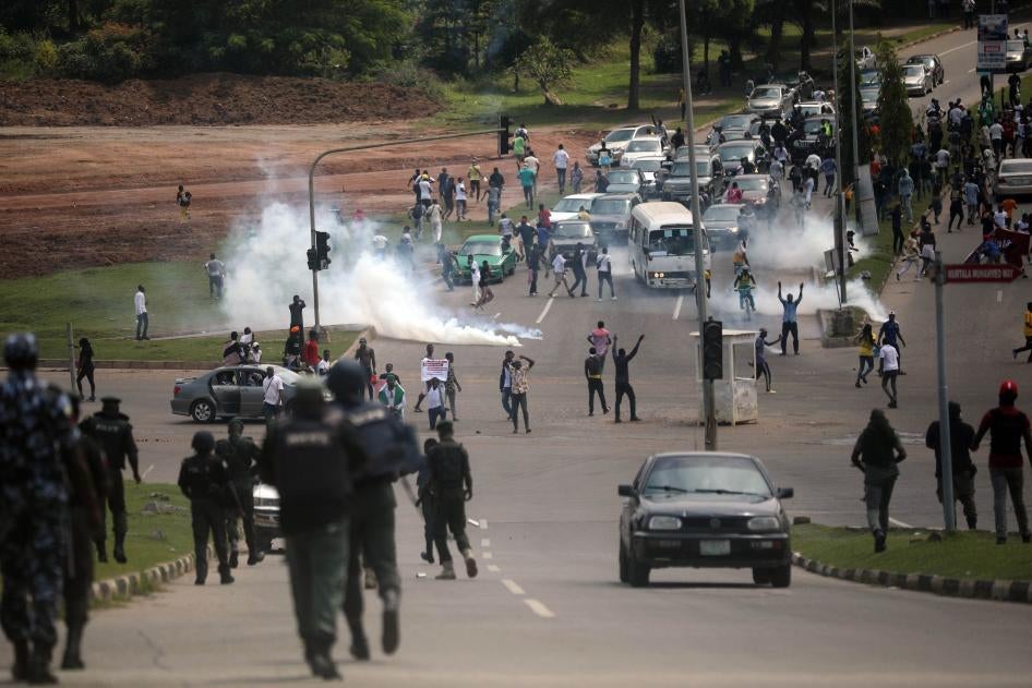 Officers of the Nigerian Police Force fire teargas at #EndSARS protesters on Abuja-Keffi Expressway, Abuja, Nigeria on October 19, 2020.