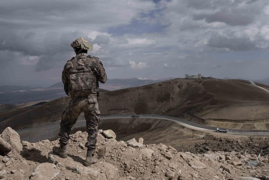 A Turkish soldier stands at the Turkish border with Iran