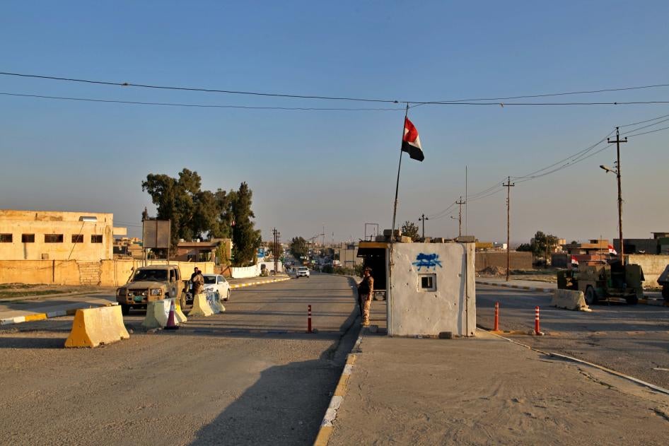 Iraqi soldiers stand guard at a checkpoint in Nineveh, Iraq. Friday Dec. 4, 2020.