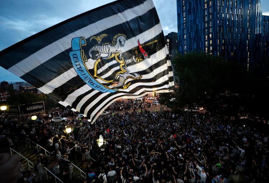 Fans react outside the stadium after the announcement of the Newcastle Takeover in St James' Park, Newcastle, Britain on October 7, 2021. 