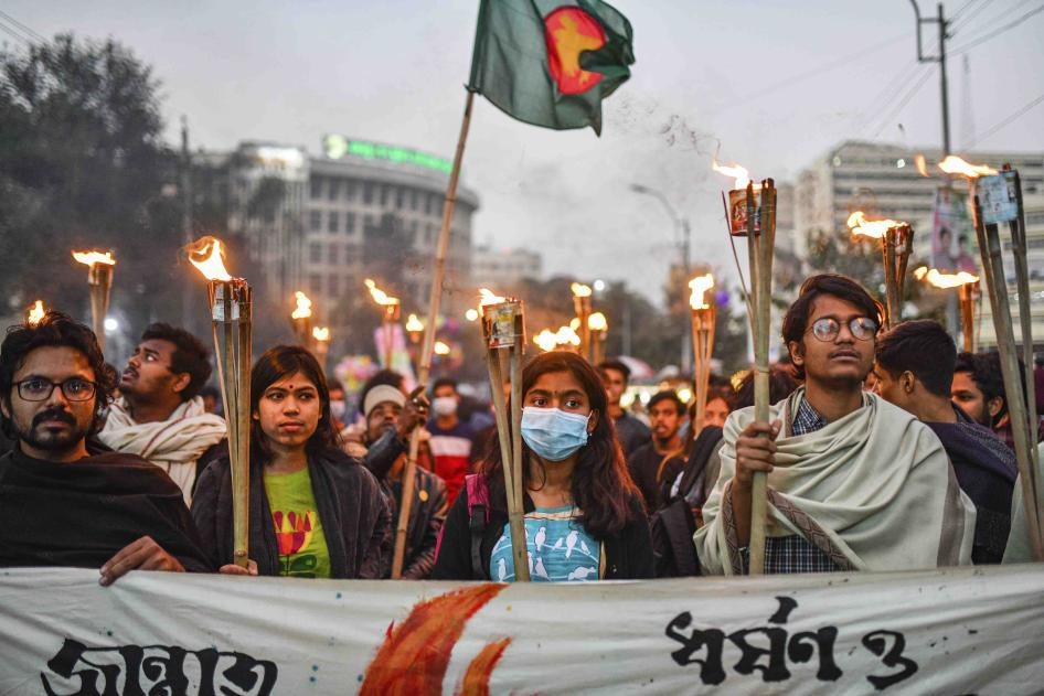 Students and activists take part in a torch procession demanding for the government to take action against murder and rape in Bangladesh.