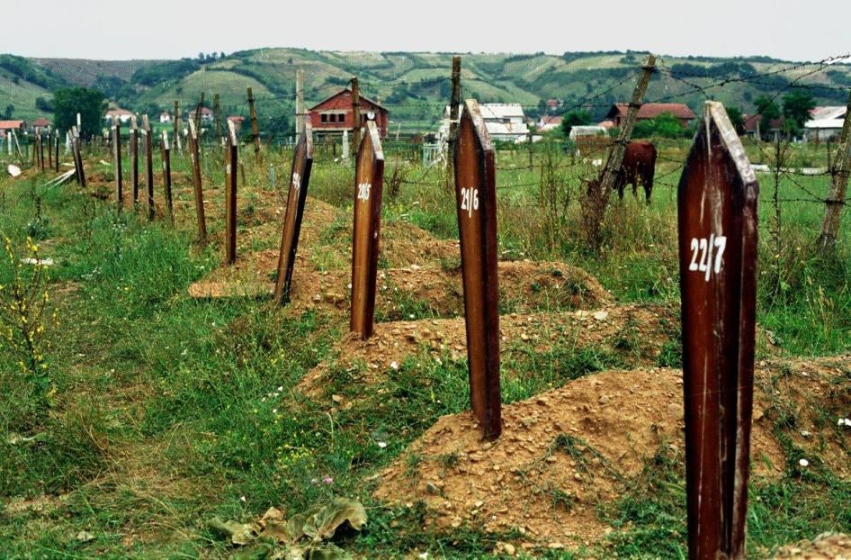 Unmarked graves in Djakovca (Gjakove) cemetery, July 1999. Witnesses said that Serbian forces exhumed and moved at least 70 bodies from here in May of that year.