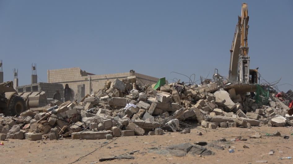 A truck searches for victims under the rubble. The house was destroyed by a Houthi missile in Al-Amoud in al-Jubah district, Marib governorate pictured on October 29, 2021.  