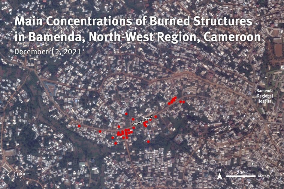 Satellite image recorded on December 12, 2021 shows the distribution of buildings damaged by fire along both sides of Mbegwi road in Bamenda, North-West region of Cameroon. Satellite image: 12 December 2021.