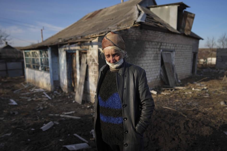 Tetyana Tomenko in front of her house, which was damaged during shelling in Novognativka, eastern Ukraine, February 20, 2022.