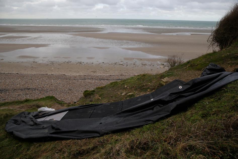 A damaged inflatable small boat is pictured on the shore in Calais, northern France, November 25, 2021.