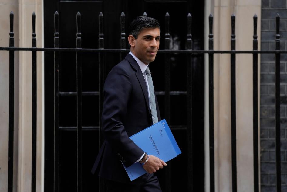 Rishi Sunak, Britain's Chancellor of the Exchequer, poses for the media as he leaves 11 Downing Street