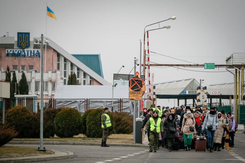 People fleeing Ukraine enter Poland through the border crossing Korczowa, Poland, March 4, 2022.