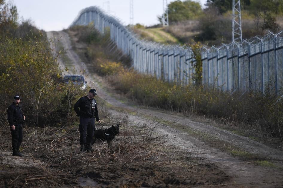 Bulgarian police patrol the border fence on the Bulgaria-Turkey border near the village of Matochina on November 4, 2021. © 2021 Nikolay Doychinov/AFP via Getty Images