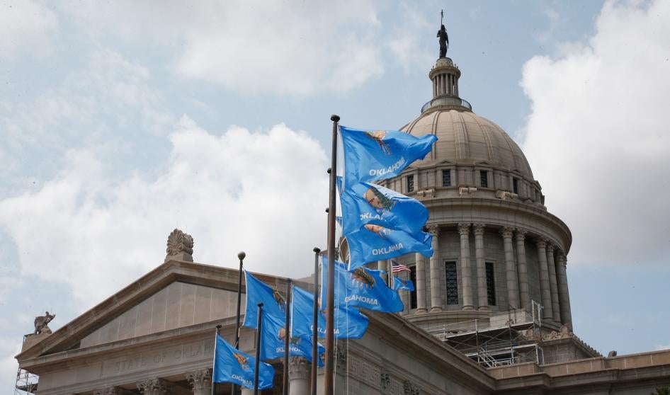 The state Capitol in Oklahoma City with state flags flying in front
