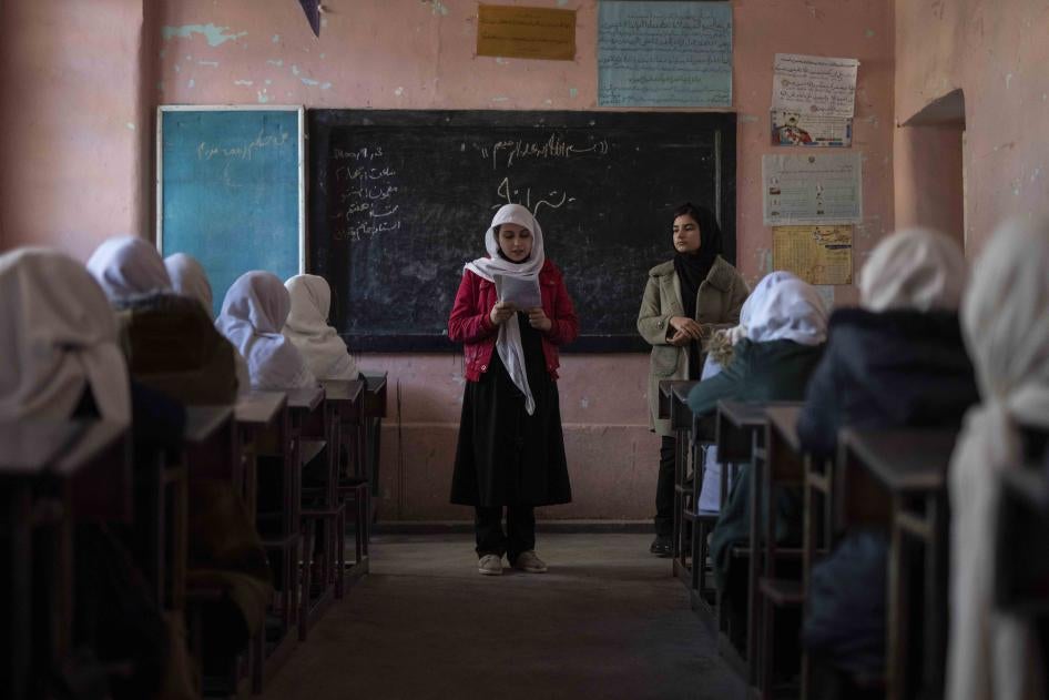 An Afghan girl reads in a classroom at Tajrobawai Girls High School, in Herat, Afghanistan, November 25, 2021.