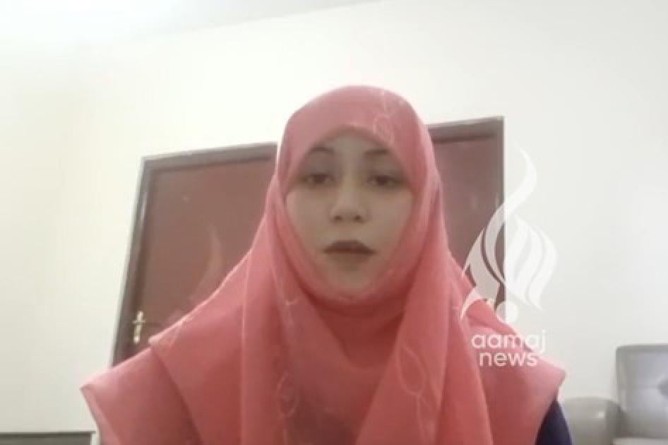 Screenshot from an online video of a woman speaking to camera