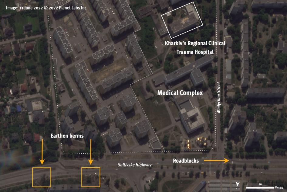 Satellite image recorded on June 11, 2022, two weeks before the attack on the Regional Clinical Trauma Hospital in Kharkiv city on June 26, shows roadblocks and earthen berms north of the medical complex.  