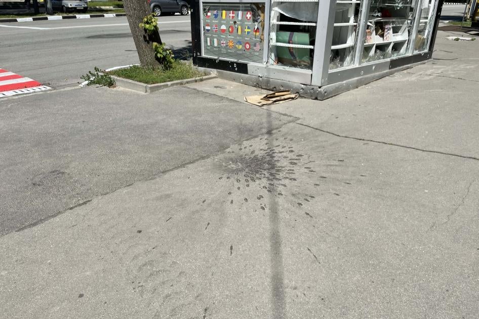The impact pattern after the detonation of a submunition, one of at least a dozen in the area, outside the women’s outpatient services of Kharkiv’s City Maternity Clinic No. 1, after a May 23 attack that damaged the hospital, May 27, 2022.