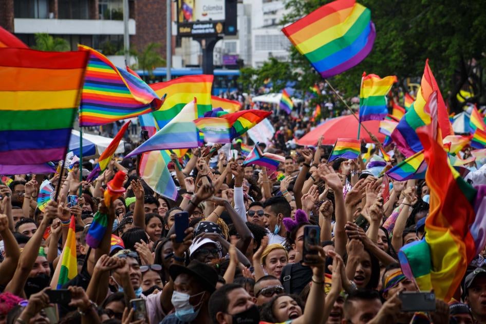 Flags of the LGTBIQ community raise and wave as people gather to protest and celebrate the International Pride Day celebrations in Cali, Colombia, July 4, 2021. 