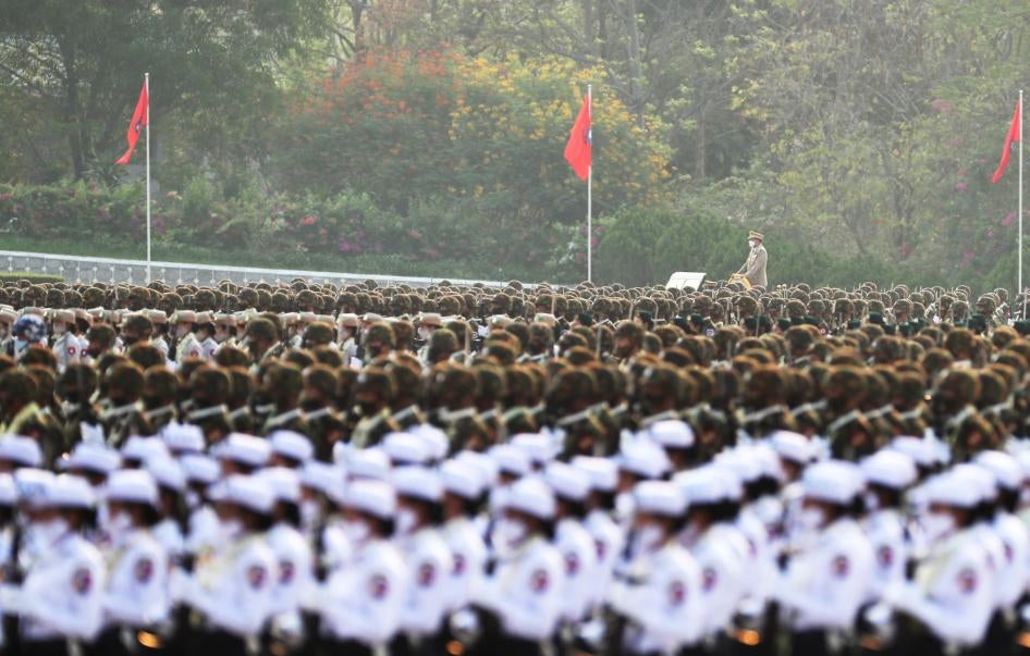 Officers march during a parade to commemorate Myanmar's 77th Armed Forces Day