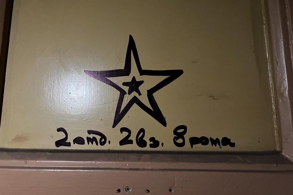 2nd squad, 2nd platoon, 8th company was written on a door in Izium’s Cultural Center, which Russian forces occupied as a base. The Cultural Center is next door to the City Railway Polyclinic, where forces held and tortured people, September 27, 2022 
