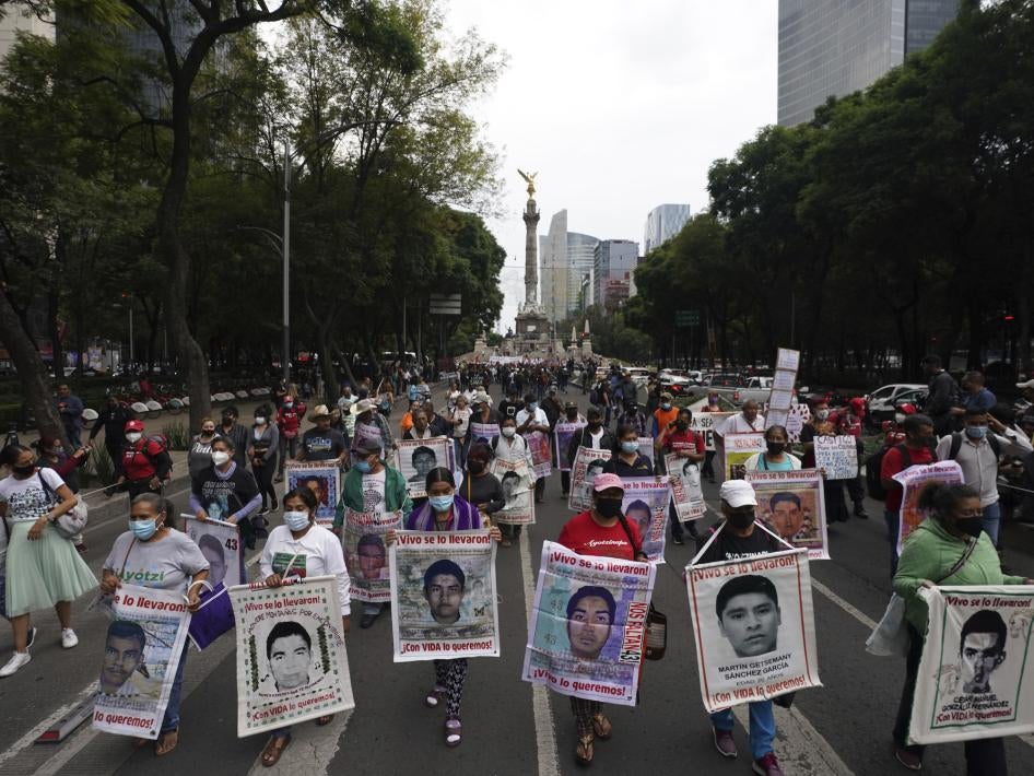 Families and friends march in Mexico City seeking justice for the missing 43 Ayotzinapa students on the eighth anniversary of their disappearance.