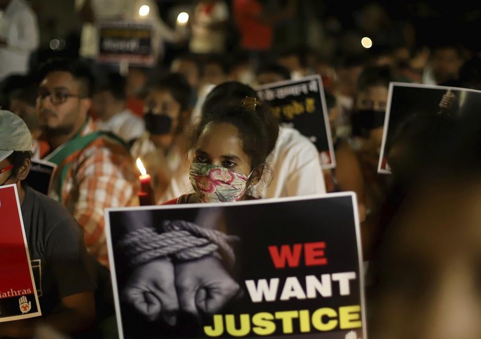 Activists protest against gender-based violence, in Delhi, India.