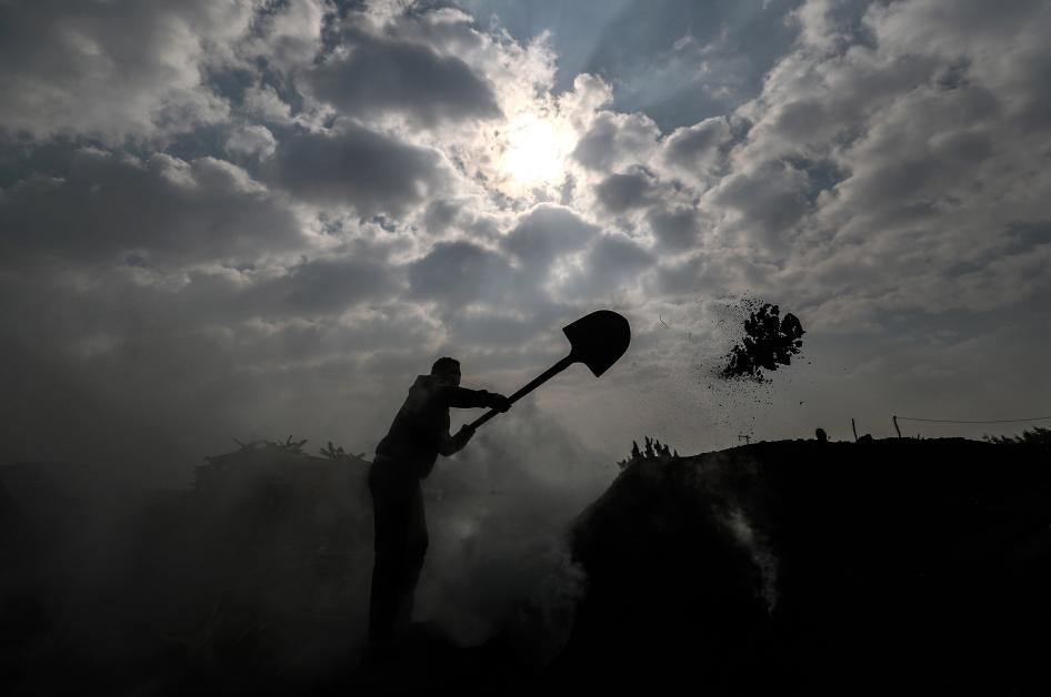 An Egyptian laborer works at a charcoal factory in Egypt's Sharkia governorate, in the fertile Delta north of the capital Cairo, on Jan. 29, 2020.