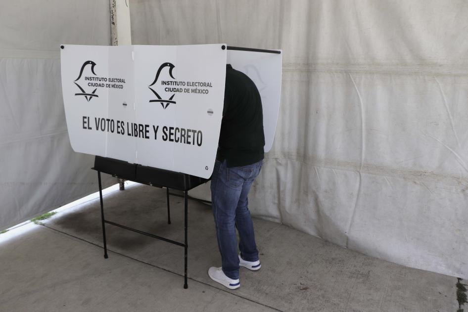 A voter casts a ballot in Mexico City, June 6, 2021.