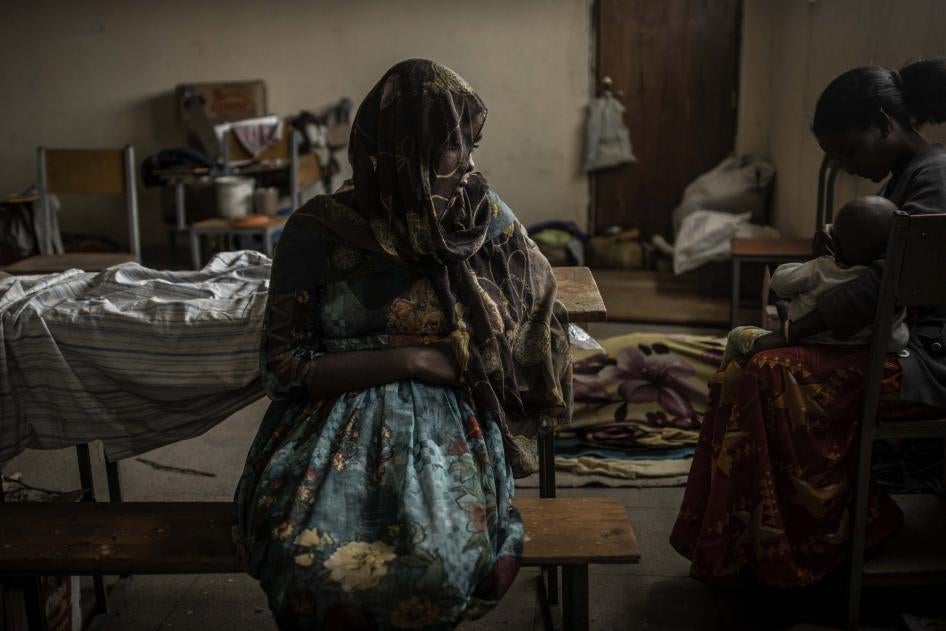 A woman sits at a school being used to house people displaced by fighting, in the city of Mekelle in Ethiopia's northern Tigray region.
