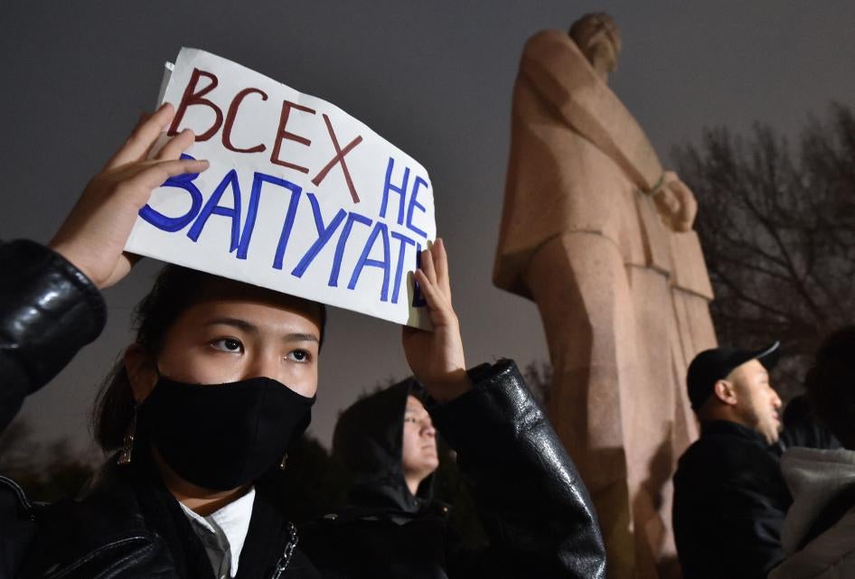 A protester holds a sign saying “don’t scare everyone” during a rally for freedom of speech and freedom for political prisoners in Bishkek, Kyrgyzstan on November 25, 2022. 
