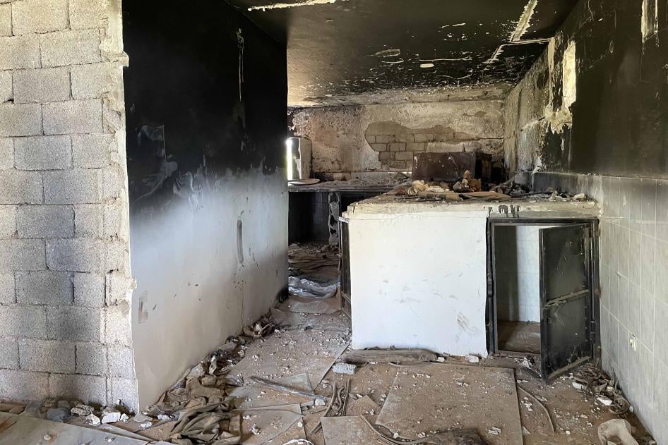 Abandoned and burnt cells at make-shift prison known as “Boxes Prison” in Tarhouna, used to detain, ill-treat, and disappear detainees during 2019-2020 conflict.