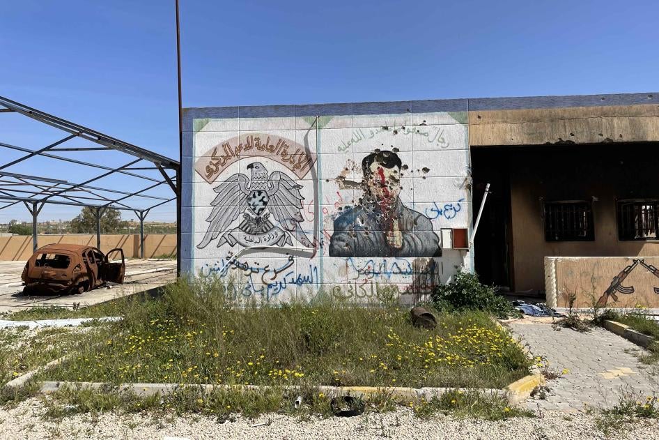Defaced mural at Central Support Prison in Tarhouna, a facility used by the al-Kaniyat militia during the 2019-2020 conflict to detain, torture, and disappear people.