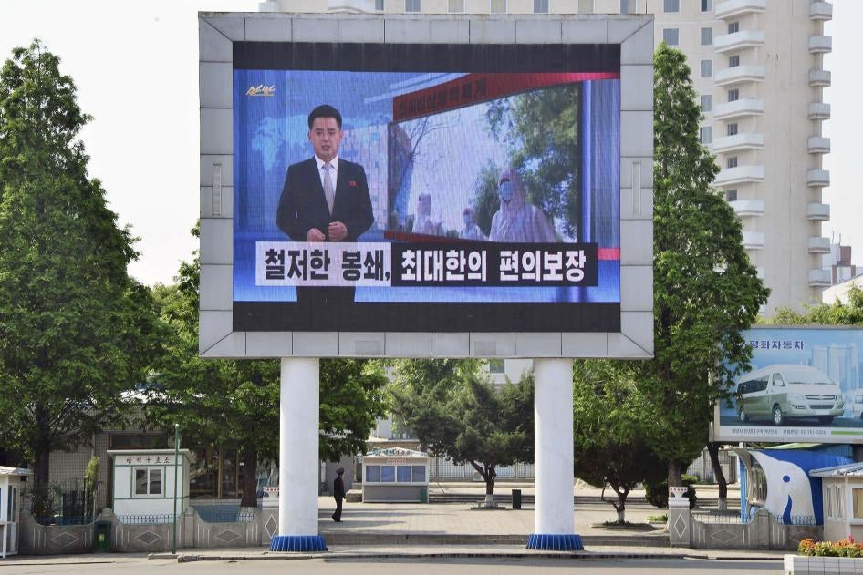 A billboard for North Korean state television in Pyongyang urges citizens to keep up their guard against Covid-19, May 23, 2022.