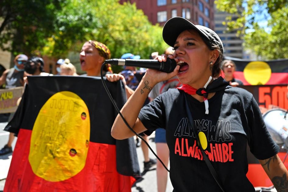 Indigenous people take part in an "Invasion Day" protest on Australia Day in Sydney.