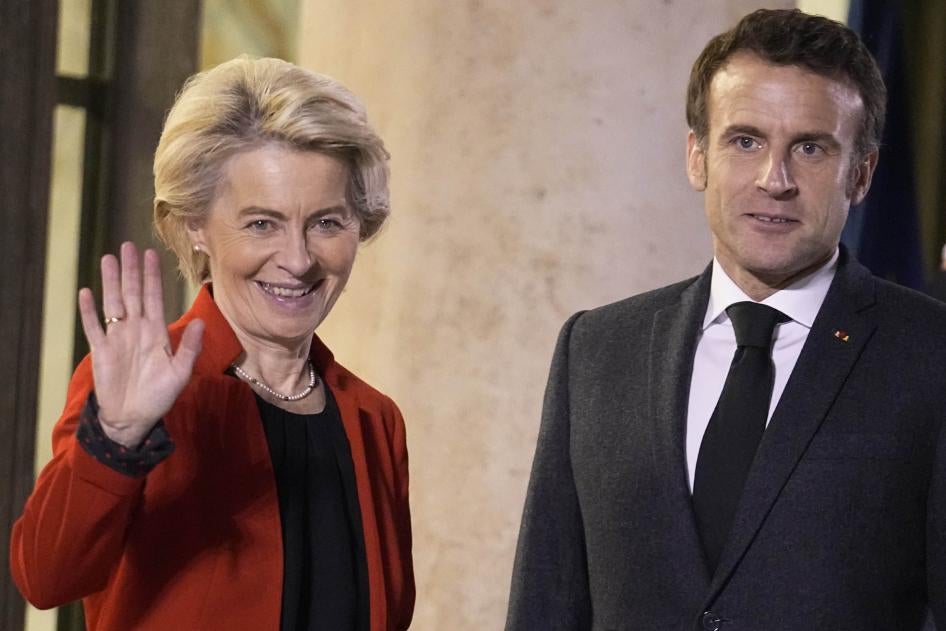 France's President Emmanuel Macron, right, welcomes European Commission President Ursula von der Leyen, at the Elysee Palace, in Paris, December 12, 2022.