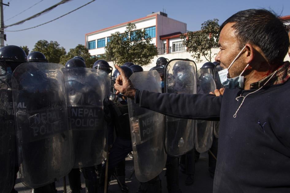 Nepalese youth clash with police as they protest outside Federal Parliament in Kathmandu, Nepal.