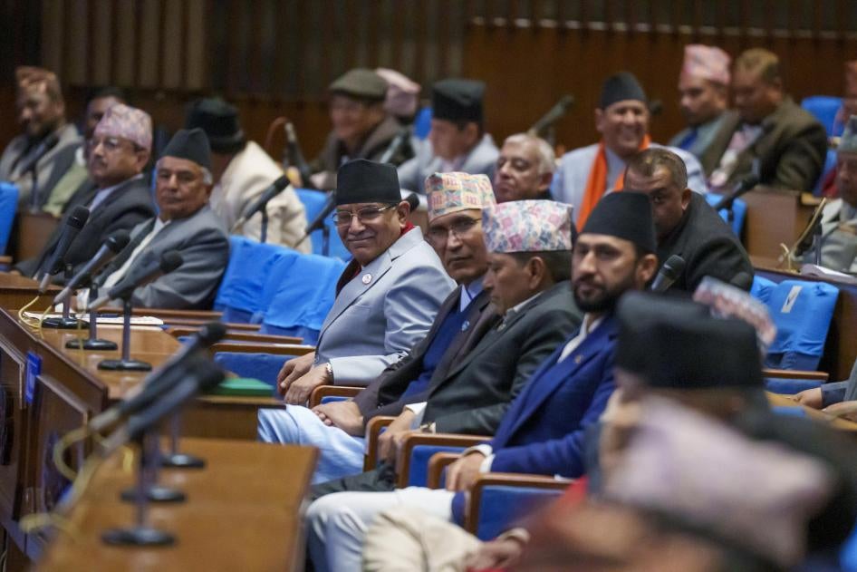 Nepali Prime Minister Pushpa Kamal Dahal, center, sits among other party leaders in parliament in Kathmandu, Nepal.