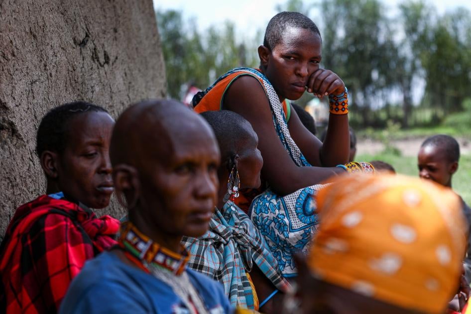 Tanzanian Maasai women evicted from their land in Loliondo sit outside a Maasai manyatta, a traditional house made with branches, mud, and cow-dung, in a village in Narok, Kenya, June 23, 2022.
