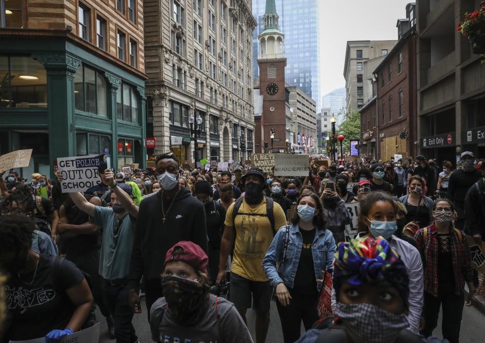 Hundreds march from Nubian Square to City Hall to urge Boston City Council to reallocate Boston police funding to youth jobs programs in Boston Public Schools in Boston, Massachusetts, US.