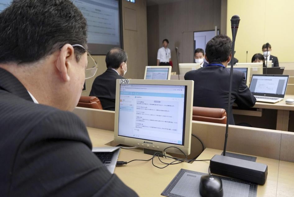Officials using ChatGPT on a desktop computer