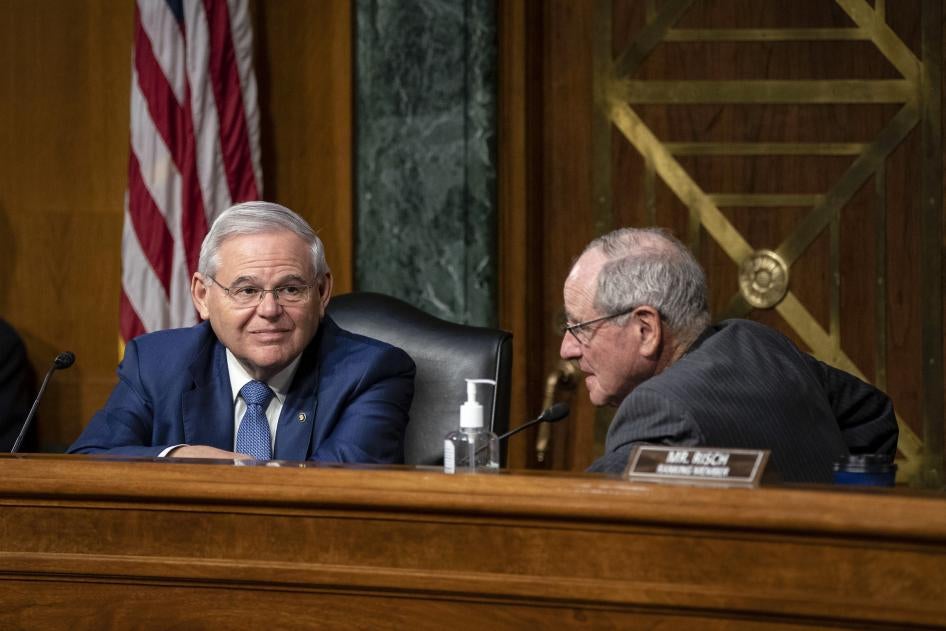 Sen. Robert Menendez of New Jersey, the chairman of the Senate Foreign Relations Committee (left), speaks with Sen. Jim Risch of Idaho, during a Senate Foreign Relations committee hearing.