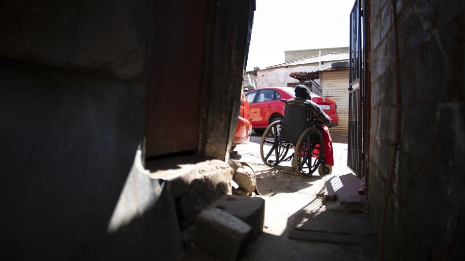 Ben Movenda, 77, a wheelchair user, outside his home