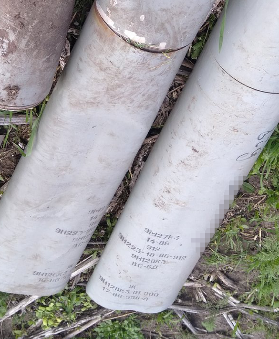 A photo posted on social media in May 2023 taken by an individual in eastern Ukraine showing two 9N128K3 warhead sections of 9M27K3 Uragan 220mm rockets, which exclusively carry and disperse PFM-1S antipersonnel blast mines. A phrase written in Ukrainian on one of the rockets says, “Від,” which translates as “from,” and Latin script that identifies a Ukrainian business. Human Rights Watch has blurred the name of the company written on the rockets and cropped the image to protect its identity. 