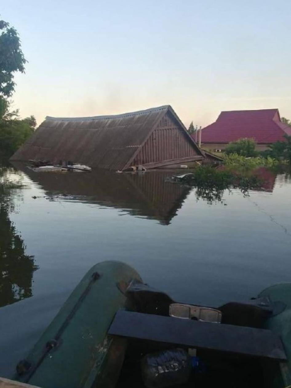 Nearly submerged houses in the flooded town of Oleshky, Ukraine, after the June 6 destruction of the Nova Kakhovka dam. Photo posted to the @kakhovkacatastrophe Telegram channel on June 12, 2023.