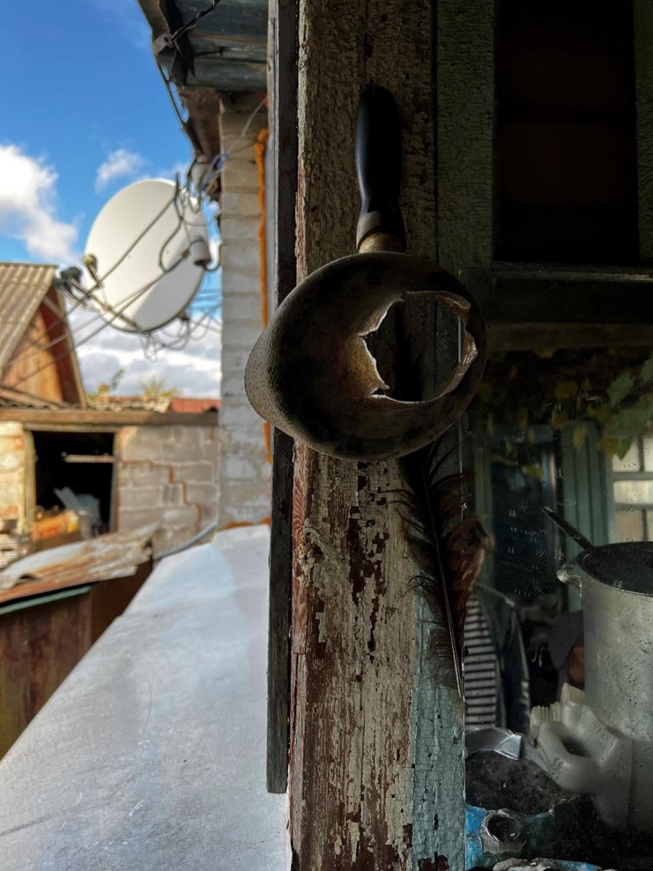 Fragments from 9N210 or 9N235 submunitions penetrated the walls of a family home on the left bank of the Siverskiy Donets River while Russian forces occupied the area in 2022, ripping a hole in this saucepan. 